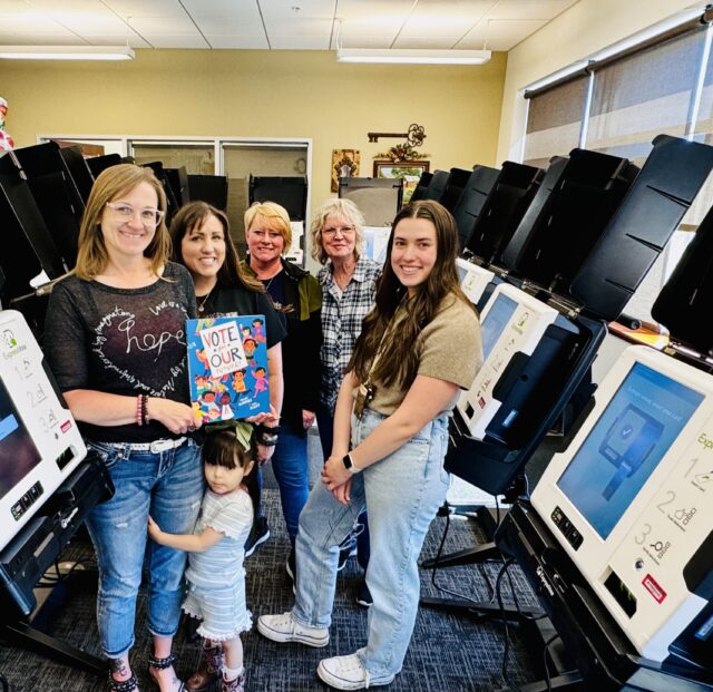 Giveaway winners Molly Gonzalez - Lander County Clerk and Lander County team accept their giveaway book.